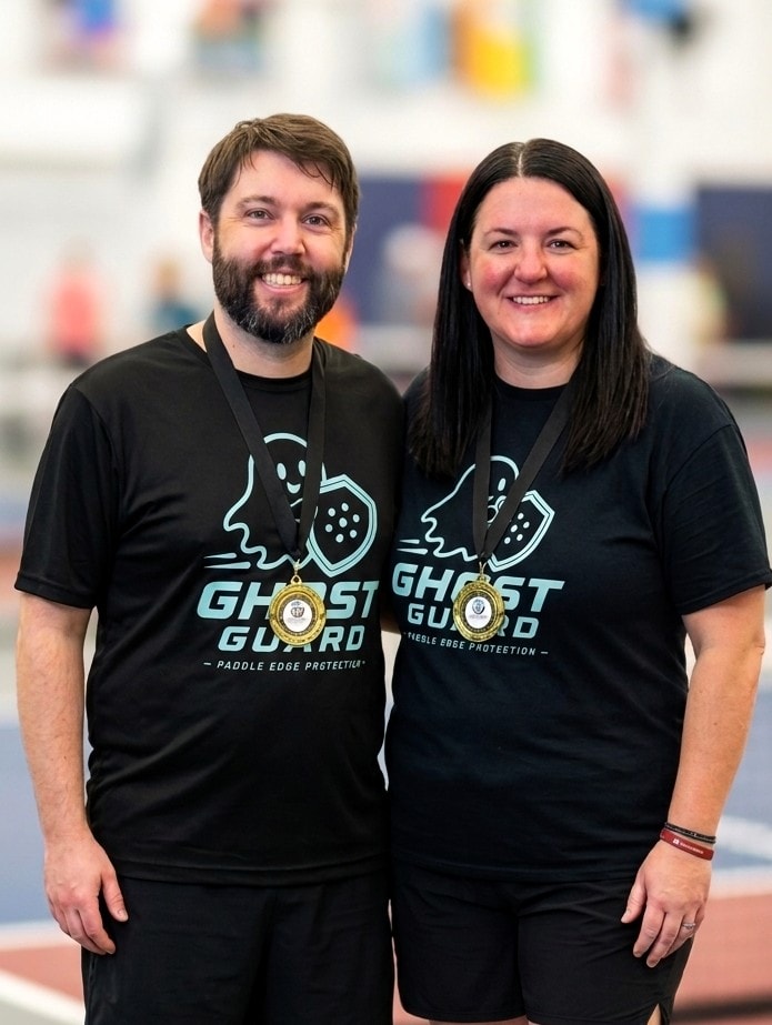 Ghost Guard founders wearing Ghost Guard shirts and tournament medals